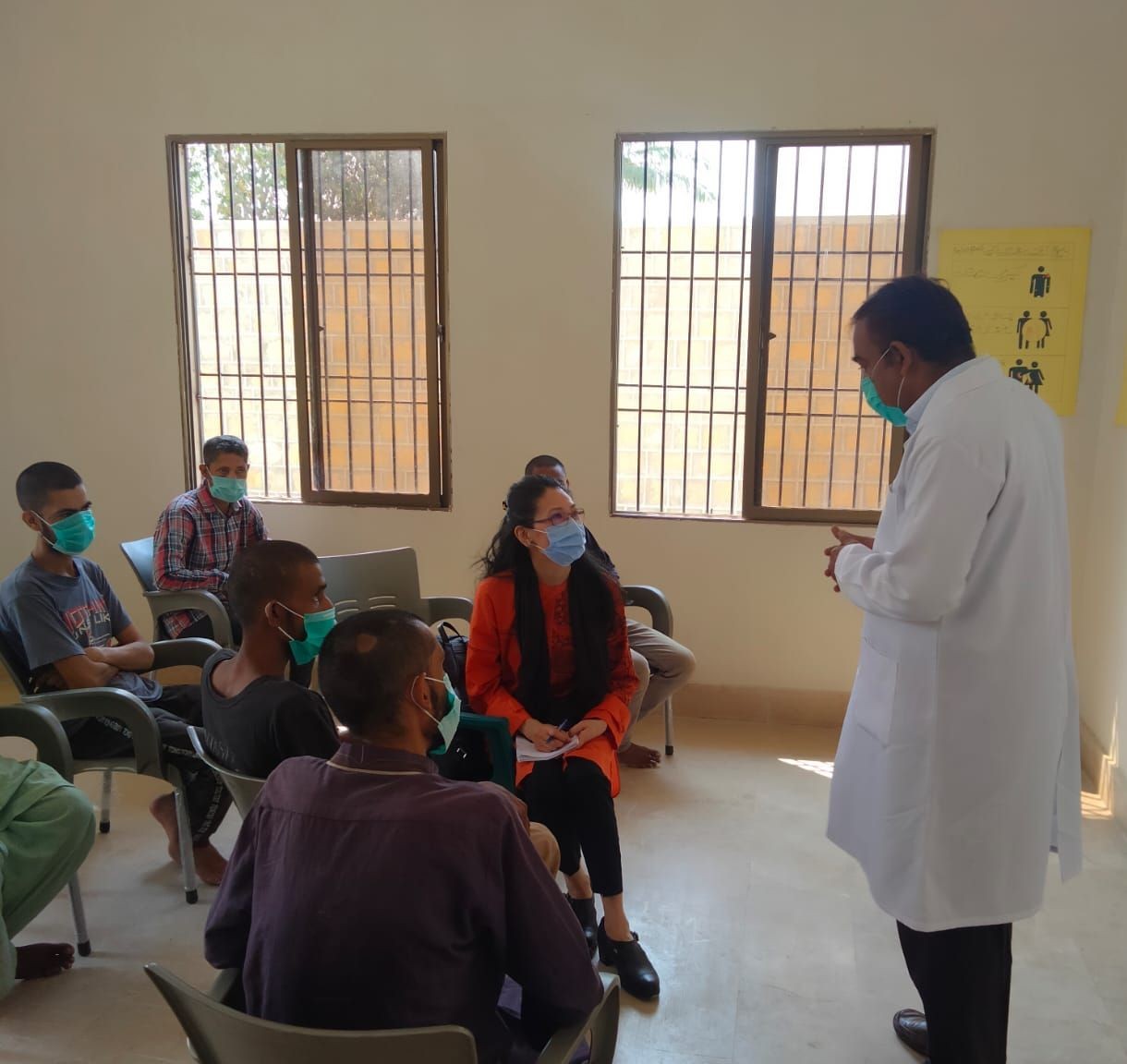 Yuki Takemoto (center) visits HIV education programs for drug users, Near Karachi, Pakistan.